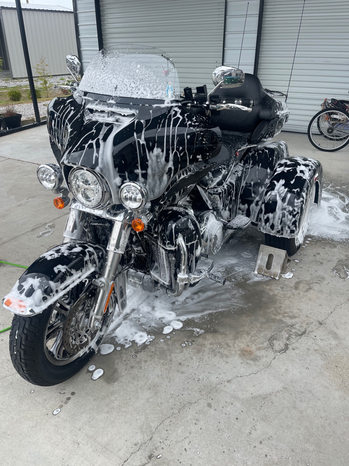 Harley-Davidson trike during foam bath detail