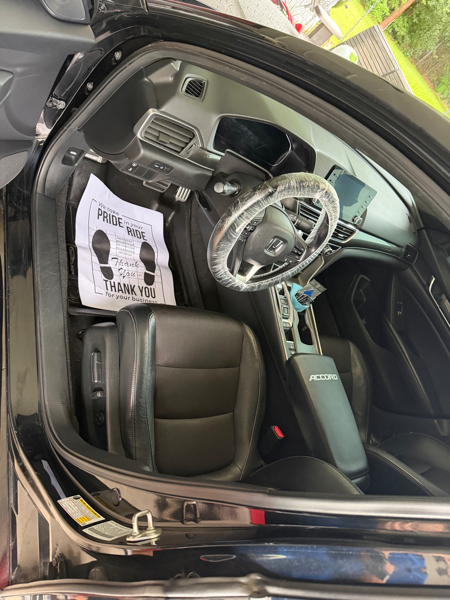Honda Accord interior after full detail — protected steering wheel and clean dash