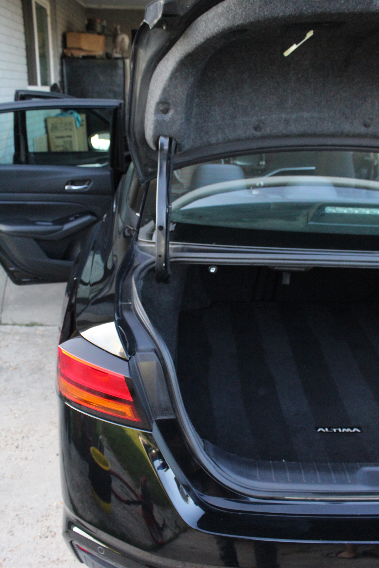 Nissan Altima trunk after full interior detail — vacuumed and cleaned